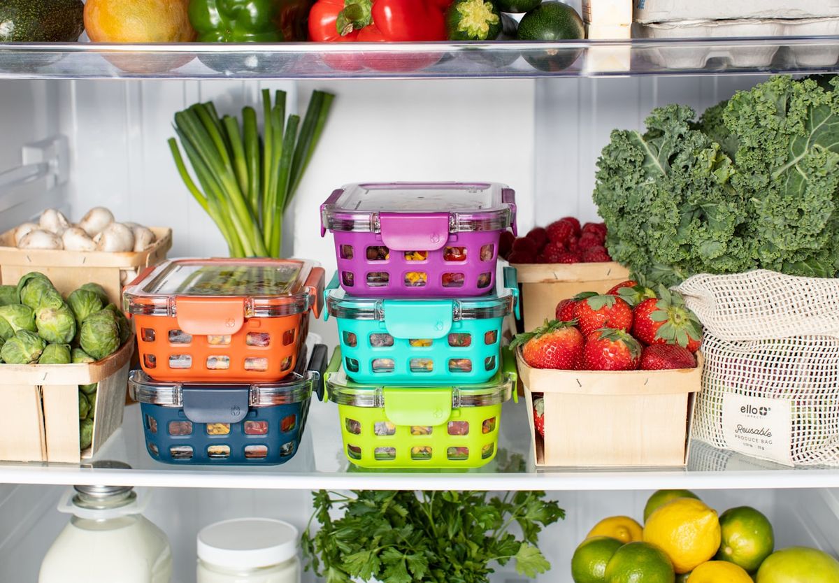 Individual glass containers of portioned soup and rice stacked ready for the freezer, photo by Ello on Unsplash