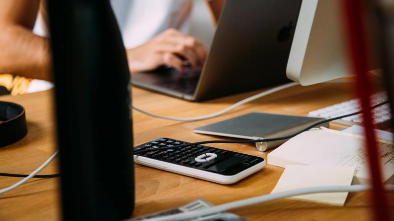 Accountant's desk with documents and laptop — AI tools for Australian accounting practices