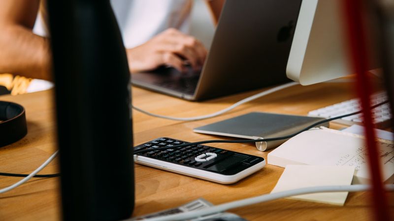 Accountant's desk with documents and laptop — AI tools for Australian accounting practices
