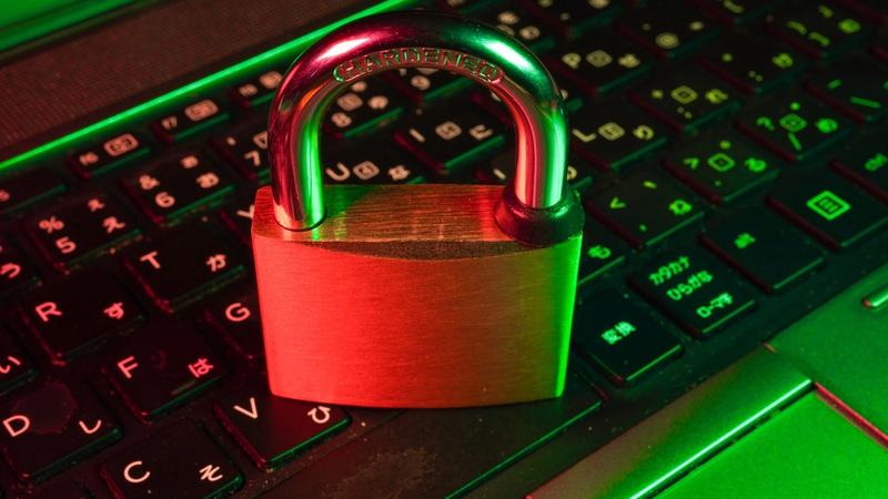 Close-up of a laptop with a padlock security icon — protecting business data when using AI tools