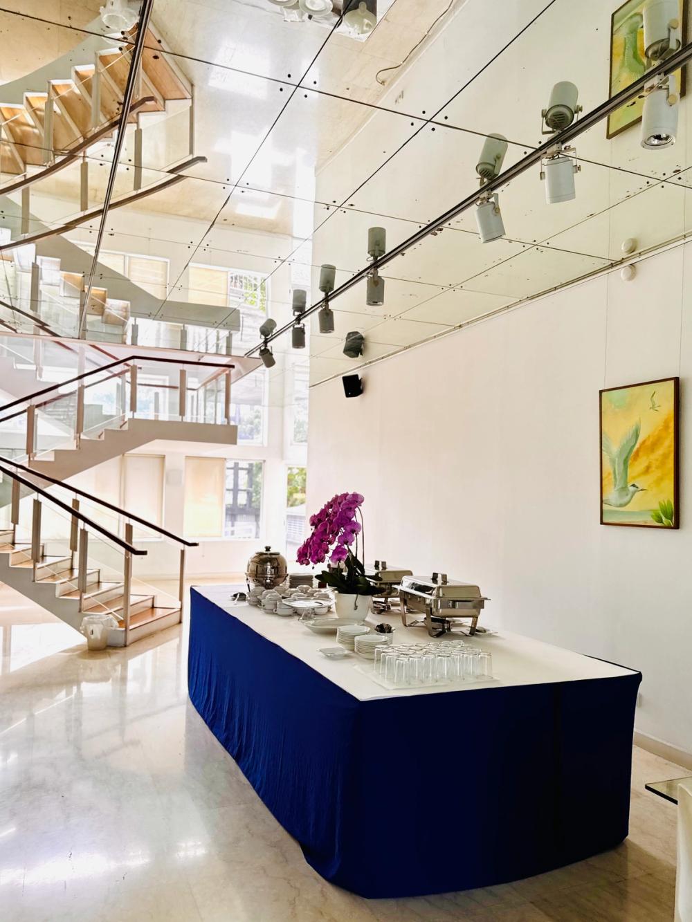 A buffet laid out in the Mawar Gallery beside the sculpted-glass staircase
