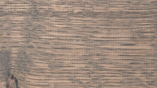 Close-up van grey-wash behandeld hout met grove nerf
