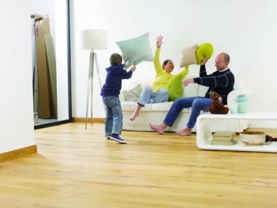 Family plays with pillows.