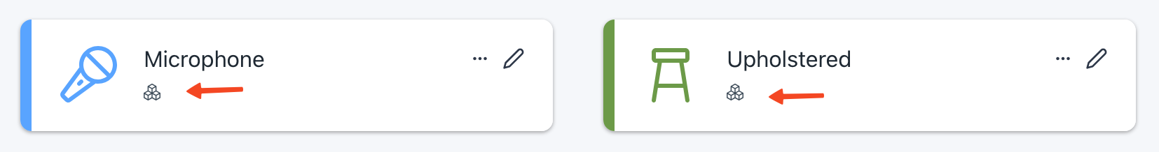 A screenshot of the Prospero app depicting two tags: "Microphone" and "Upholstered".  Arrows are pointing to a "Boxes" icon indicating they can be assigned to items.