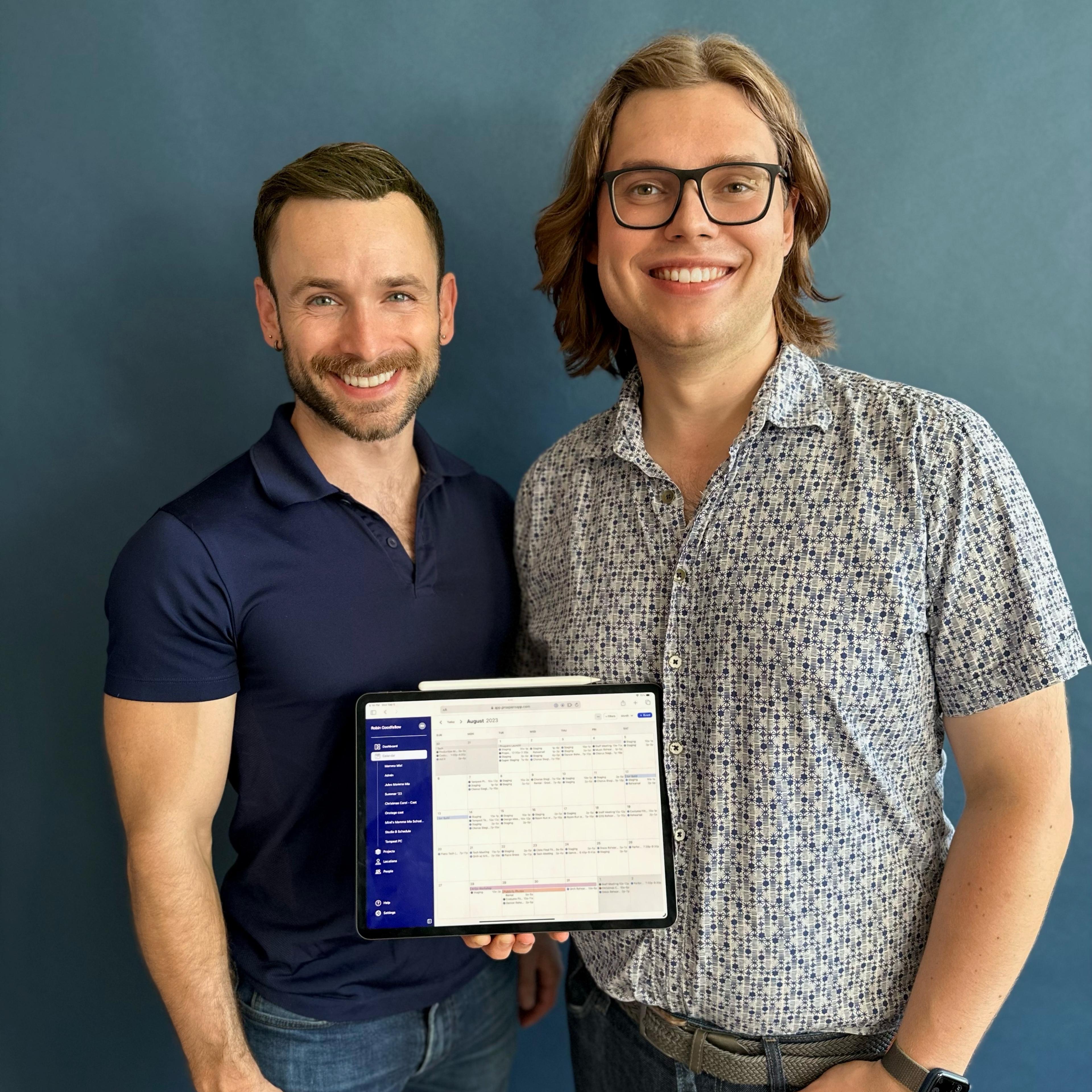 Matt (CTO) and Travis (CEO) with an iPad displaying the Prospero app