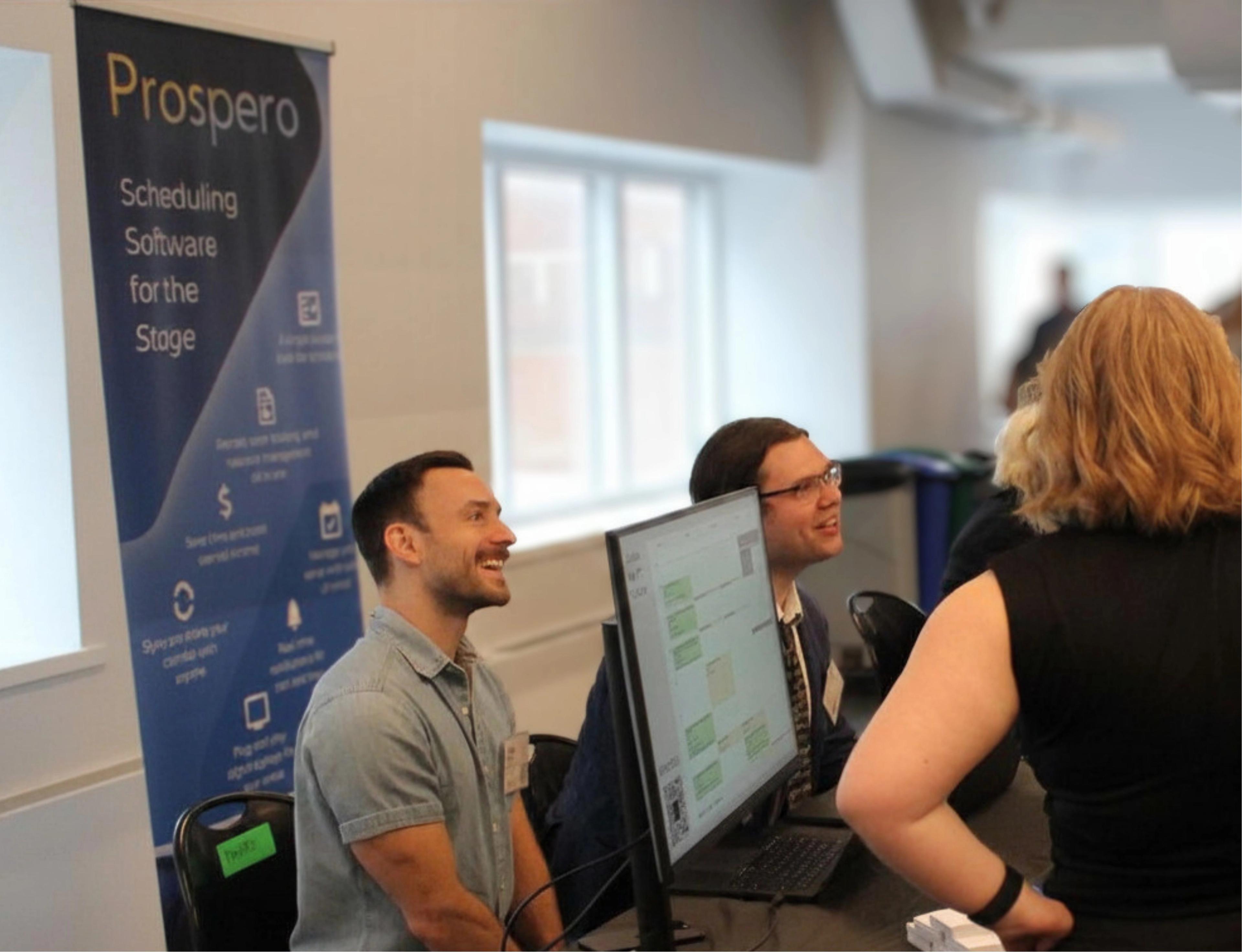 Matt and Travis talking to a potential client