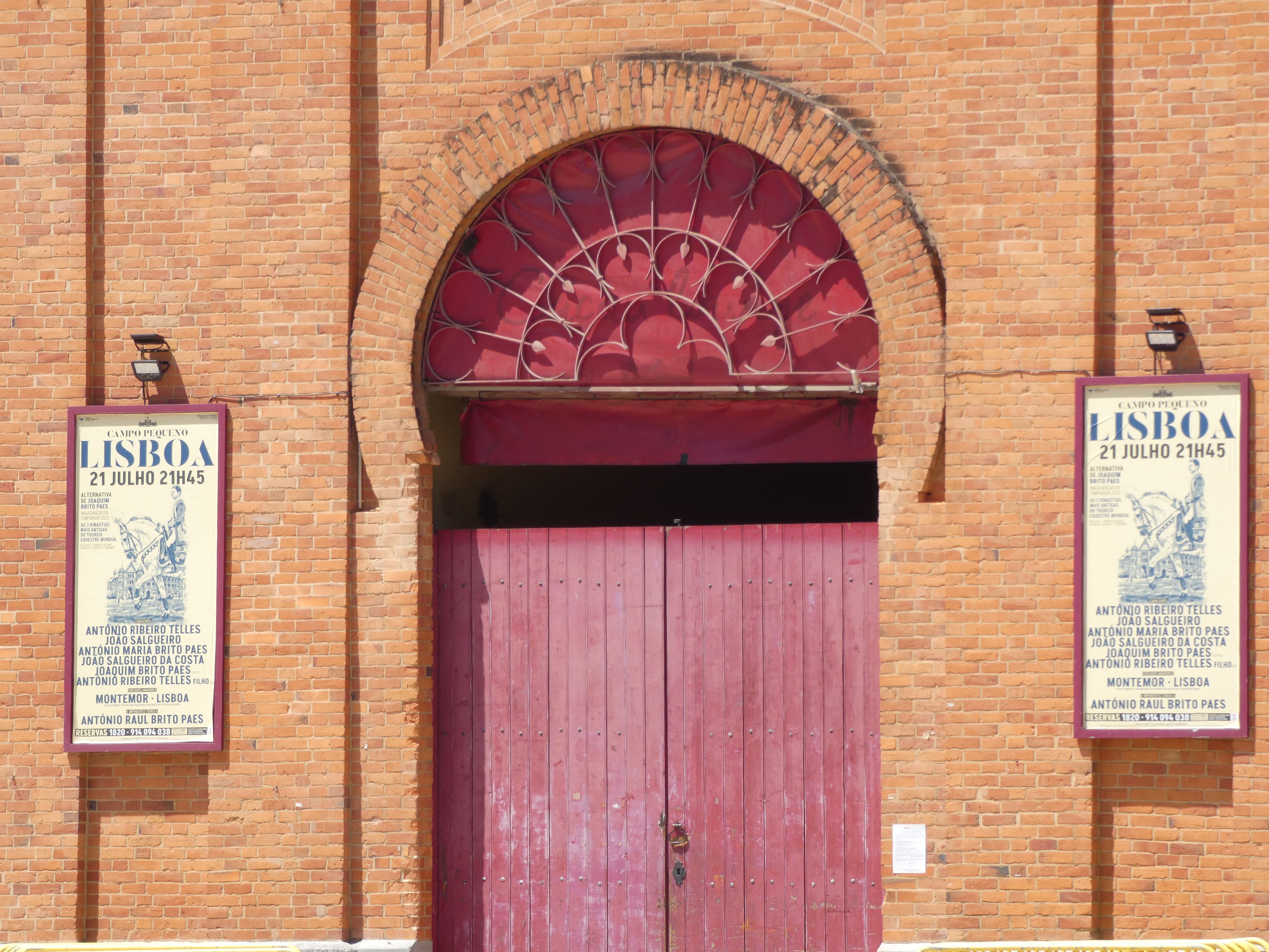 red front door from brick building