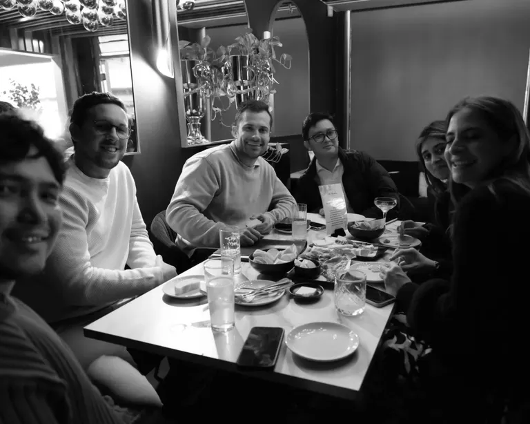 House of Psalm team dinner at restaurant table with food and drinks