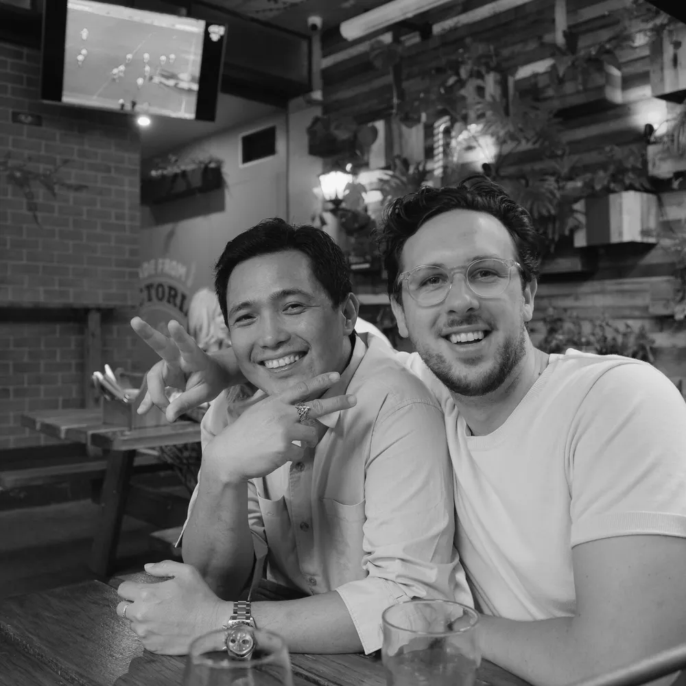 House of Psalm team members Jacob King Stanley and Ariel Lim enjoying time together at a Melbourne bar, reflecting the agency’s strong culture and collaborative spirit.