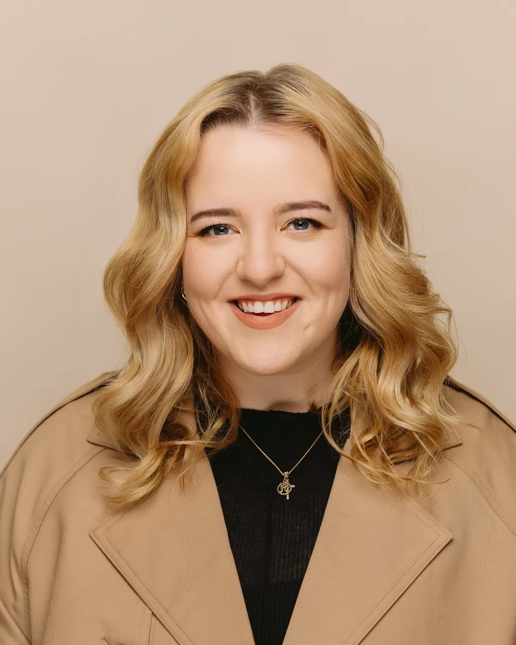 Hannah Cooper Operations Coordinator at House of Psalm professional headshot wearing black top with hands on hip