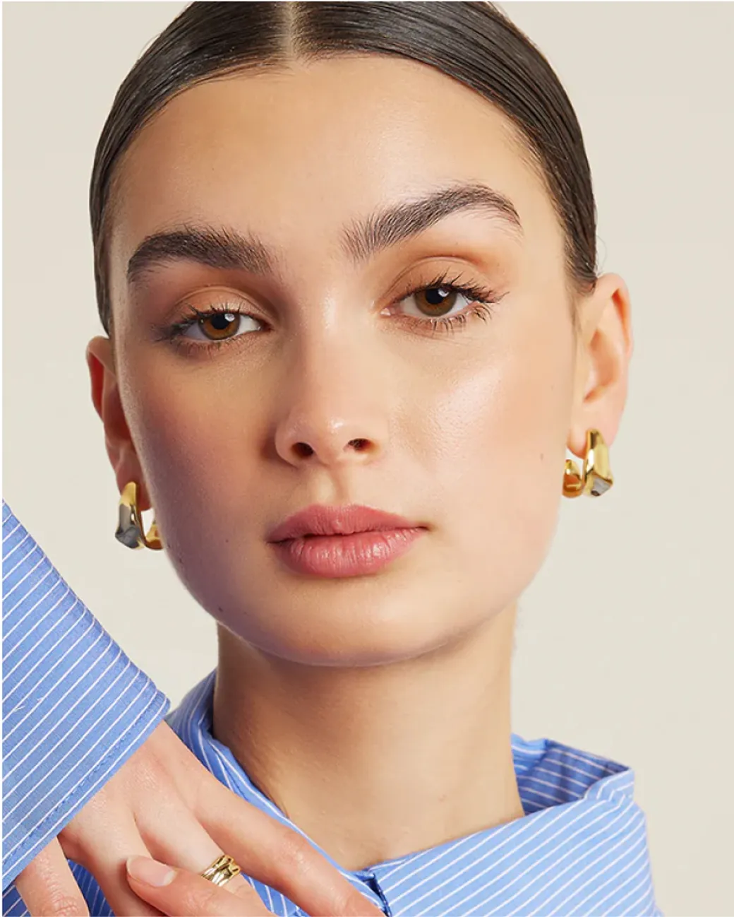 Francesca Jewellery gold hoop earrings styled with blue shirt – modern Australian jewellery brand.