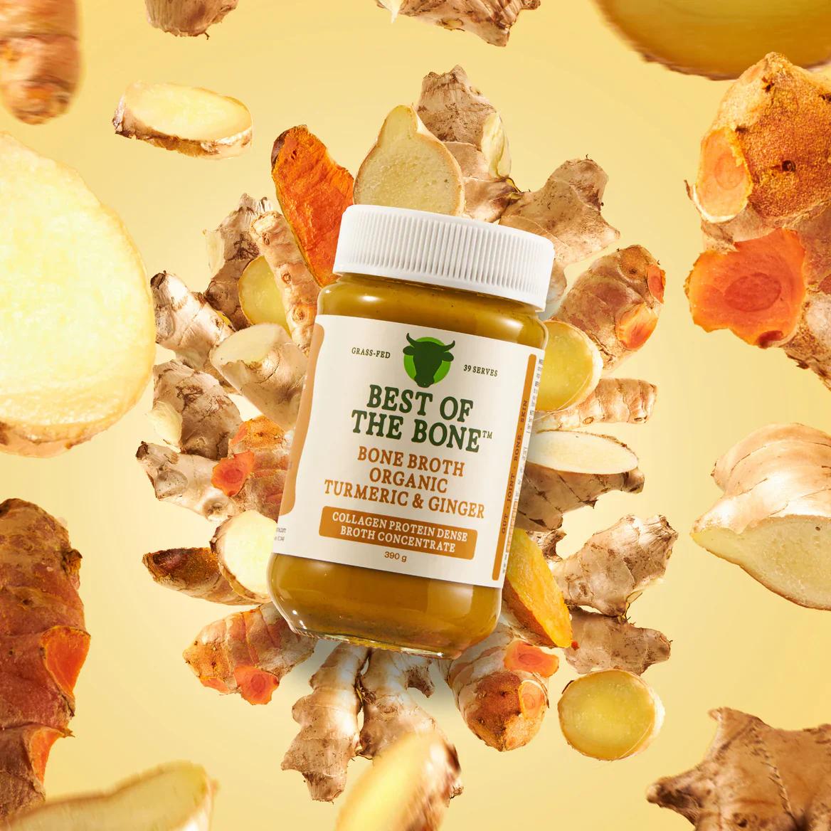 Best of the Bone organic bone broth concentrate with turmeric and ginger surrounded by fresh root ingredients