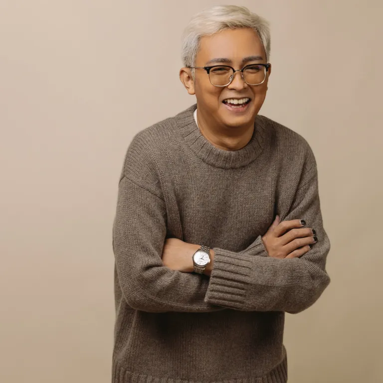 Kris Canimo Head of SEO at House of Psalm professional headshot wearing light grey jumper