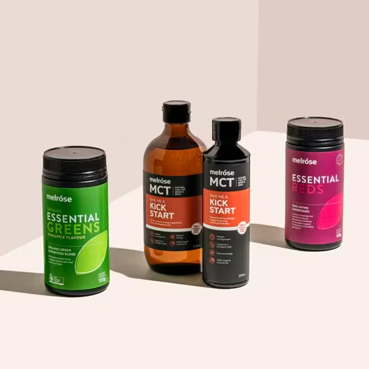 Melrose Essential Greens, Essential Reds, and MCT Oil Kick Start supplements for daily energy, gut health, and nutrition support