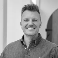 Chris Stratton Senior Digital Product Owner at Reflections Holiday's professional headshot in button-up shirt