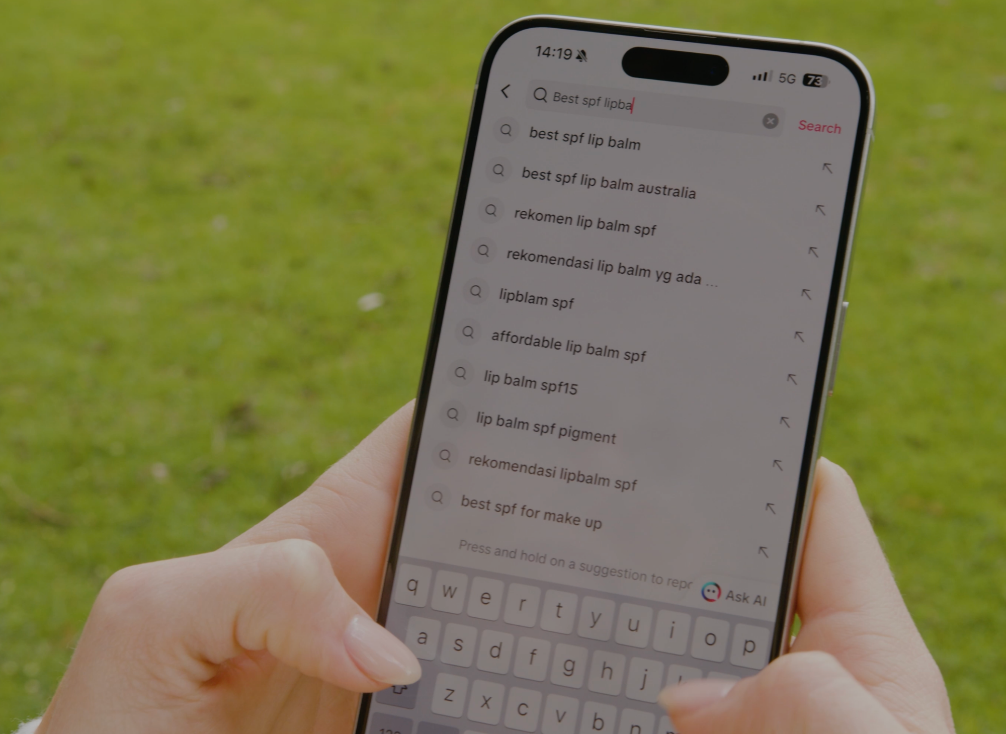Close-up of a phone screen showing search results for best SPF lip balm in tiktok, highlighting user intent in SEO.