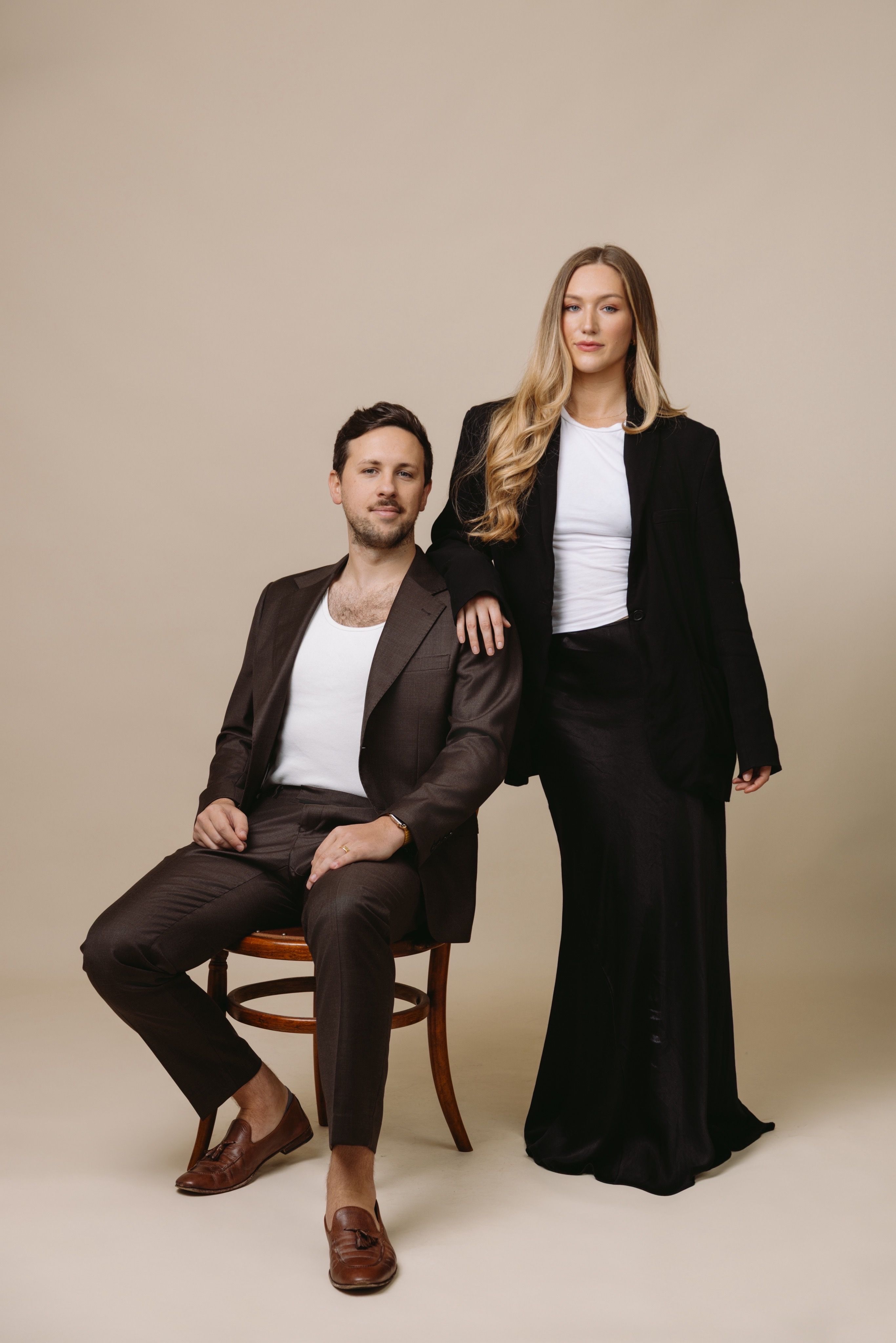 Jacob and Tara King Stanley Directors of House of Psalm professional studio portrait in formal business attire against neutral background