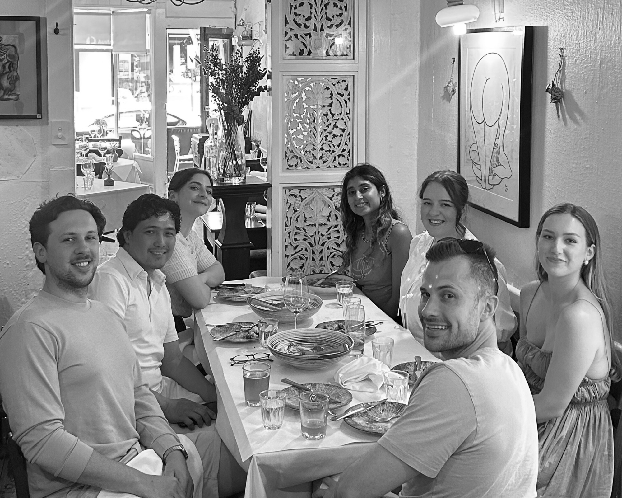 House of Psalm team group photo dining together at restaurant table