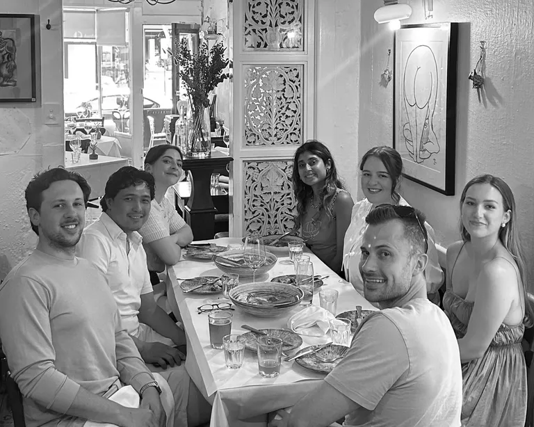 House of Psalm team group photo dining together at restaurant table