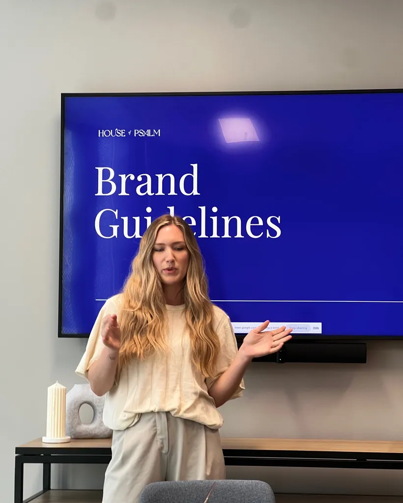 House of Psalm Creative Director presenting brand guidelines about a client to the content writer team in office workshop
