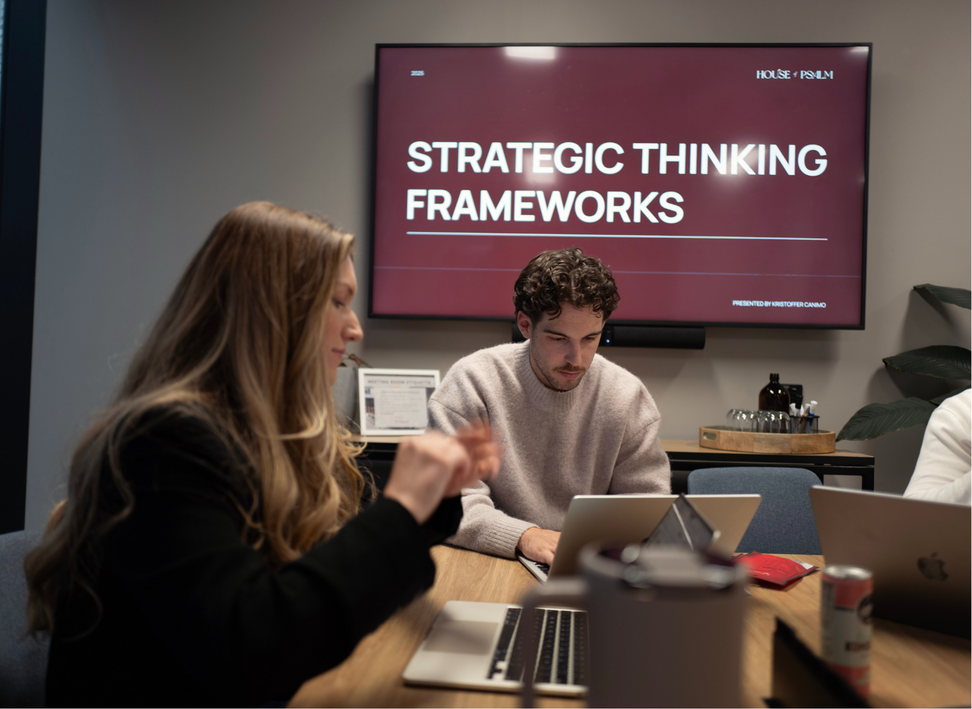 House of Psalm team in strategy meeting with presentation screen on brand performance