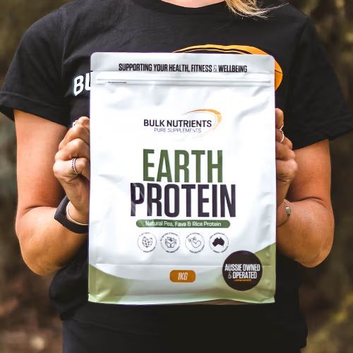 Bulk Nutrients Earth Protein pouch held outdoors, plant-based Australian protein powder