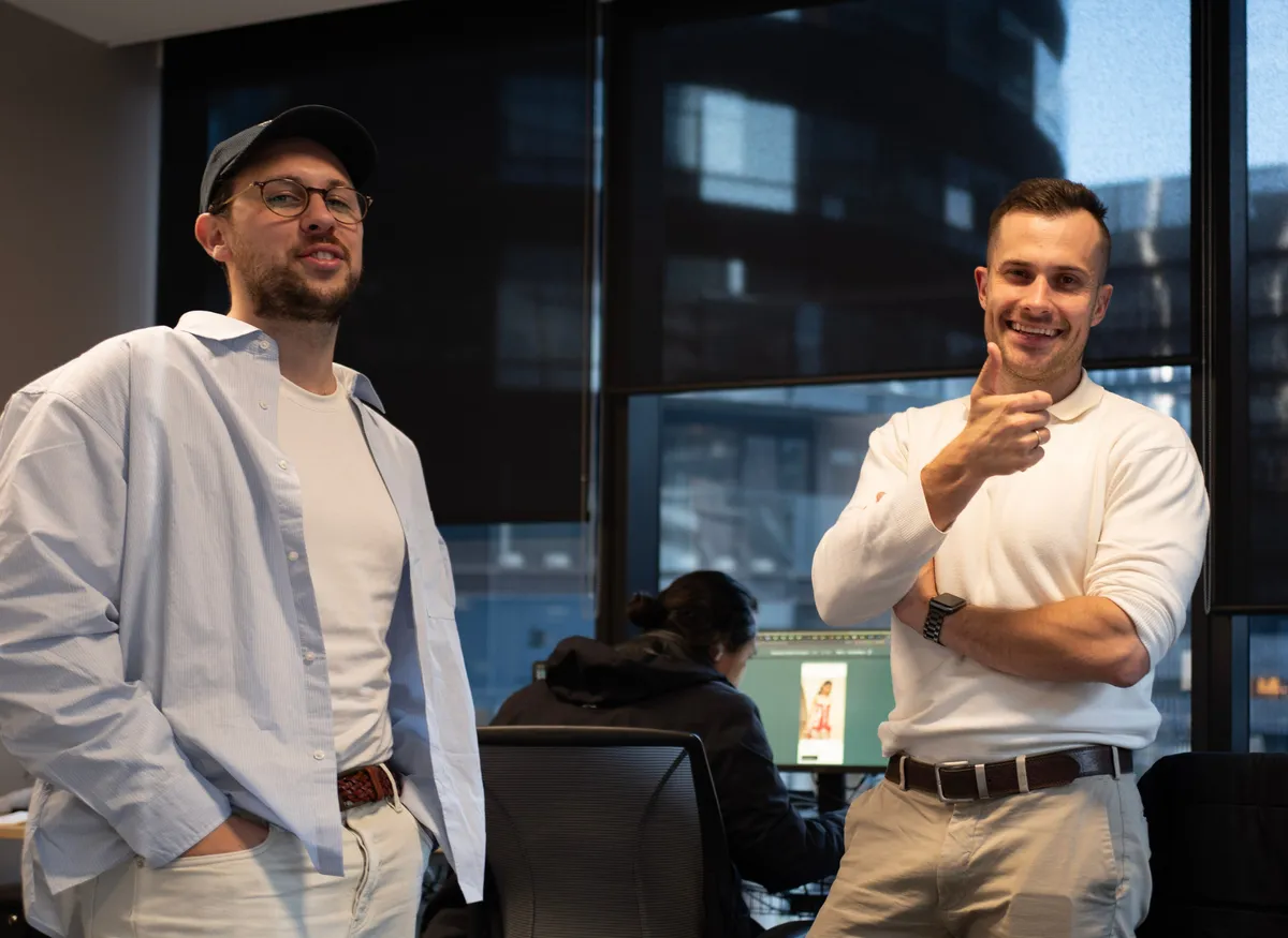 House of Psalm co-founders Jacob and Dan in the office, sharing a light moment during a creative strategy session