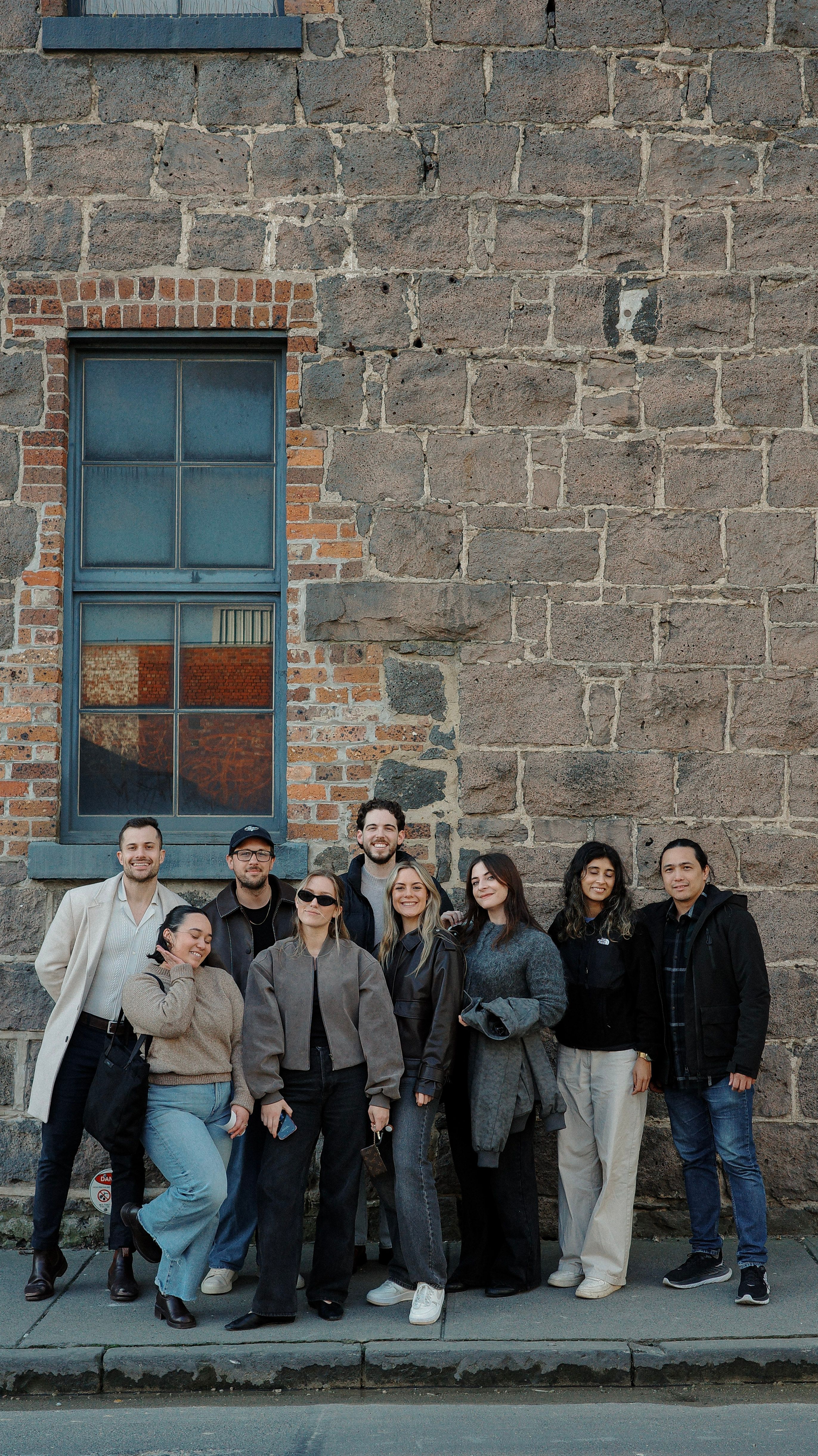 House of Psalm team group photo standing against a brick wall