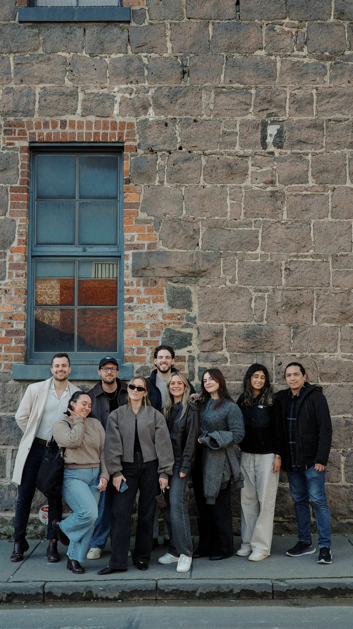 House of Psalm team group photo standing against a brick wall