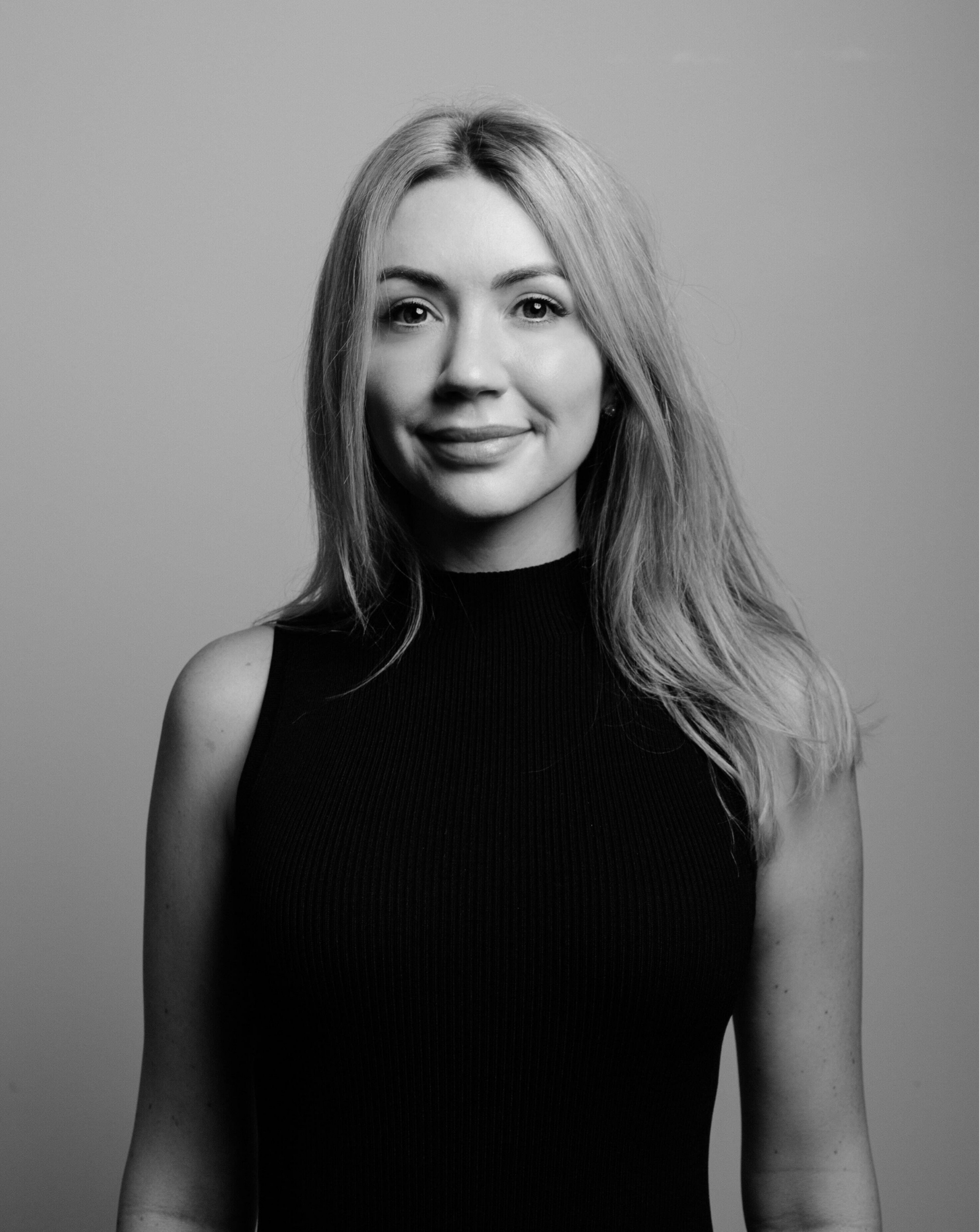 Emily Averill Digital Marketing Director at Daniels Health's professional headshot in black sleeveless top