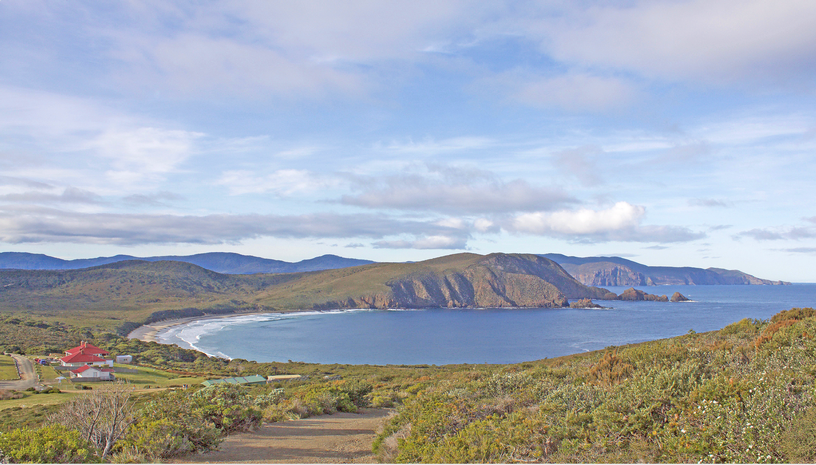 Scenic coastal view near Hobart Tasmania with rolling hills and rugged shoreline