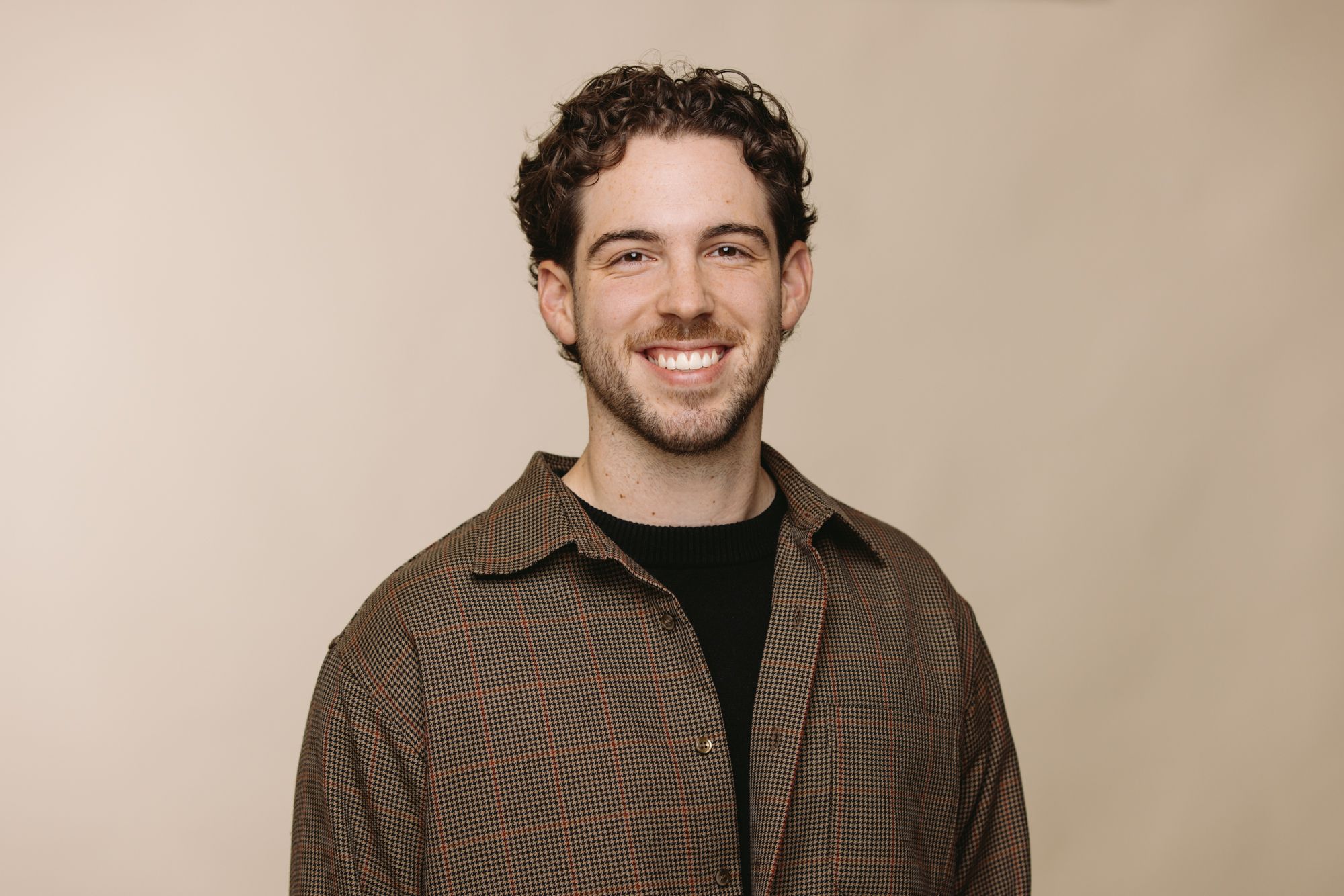Leroy Winnett SEO Specialist at House of Psalm professional headshot wearing dark brown jacket