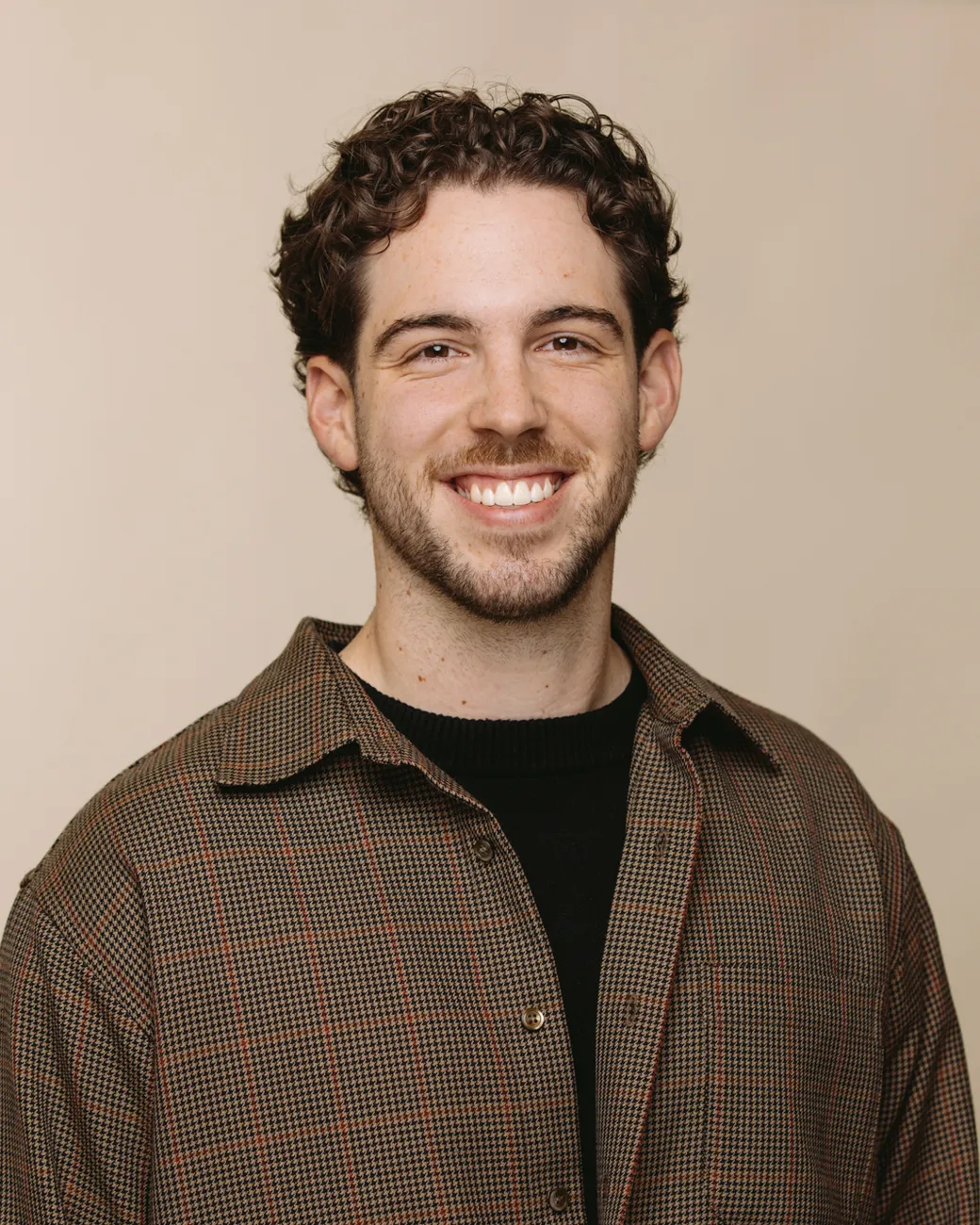 Leroy Winnett SEO Specialist at House of Psalm professional headshot wearing dark brown jacket