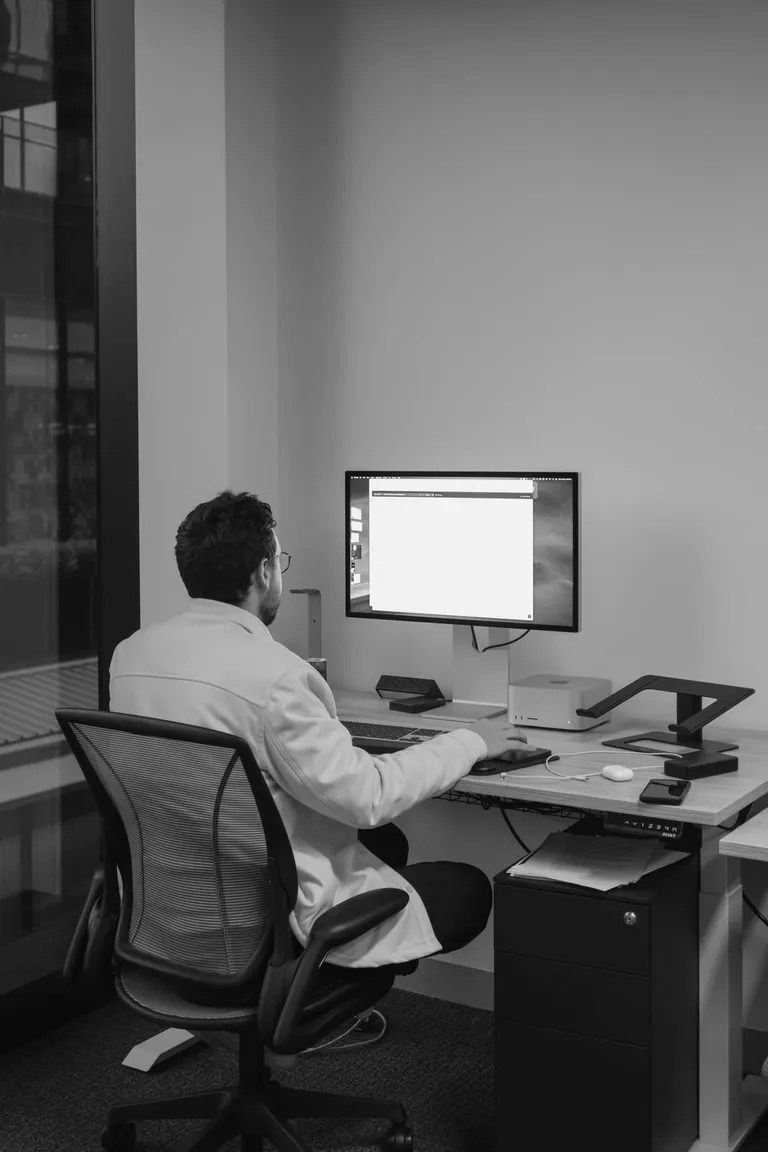 House Of Psalm at their office on their computer