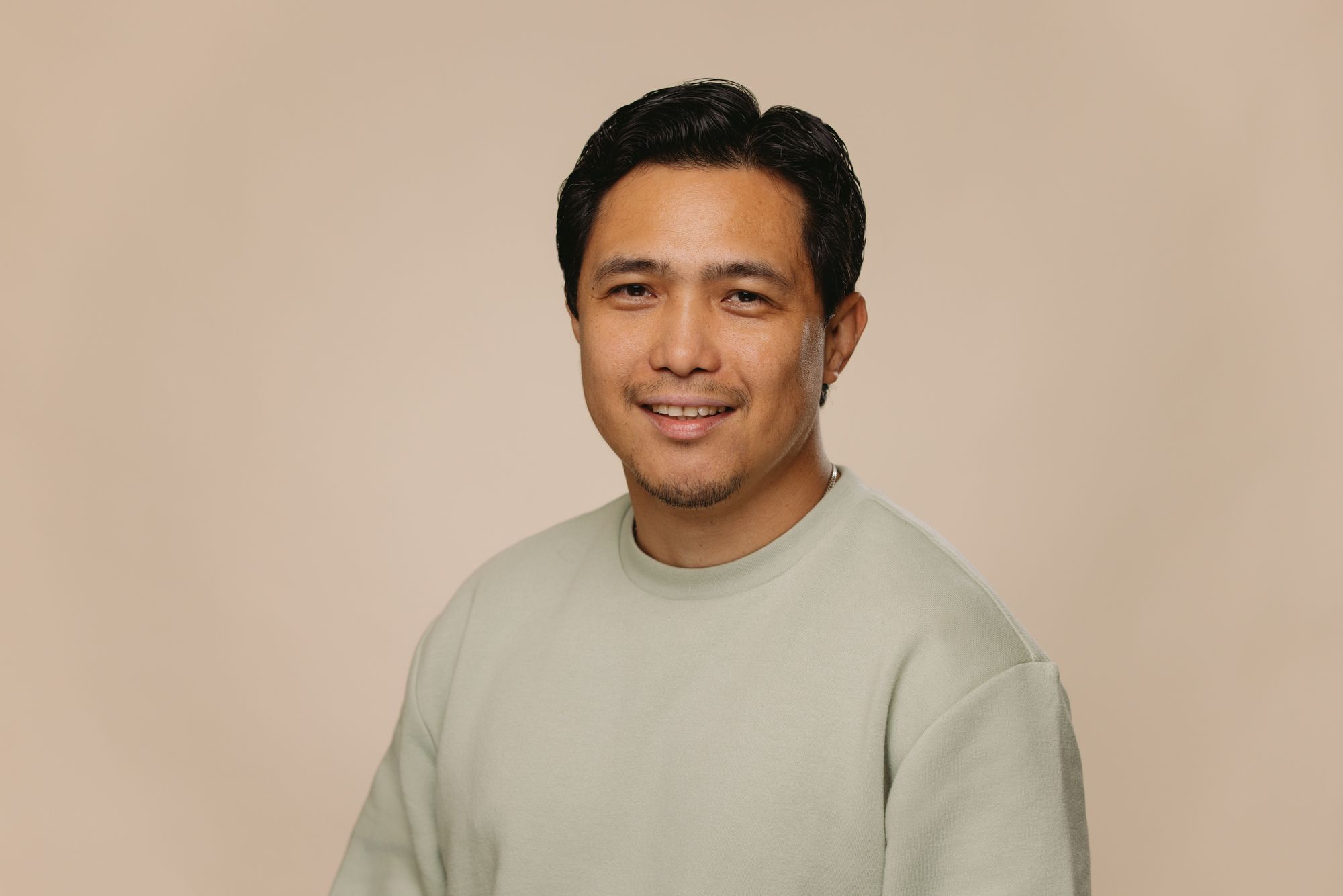 Ariel Lim Senior SEO Developer at House of Psalm professional headshot wearing pale green jumper