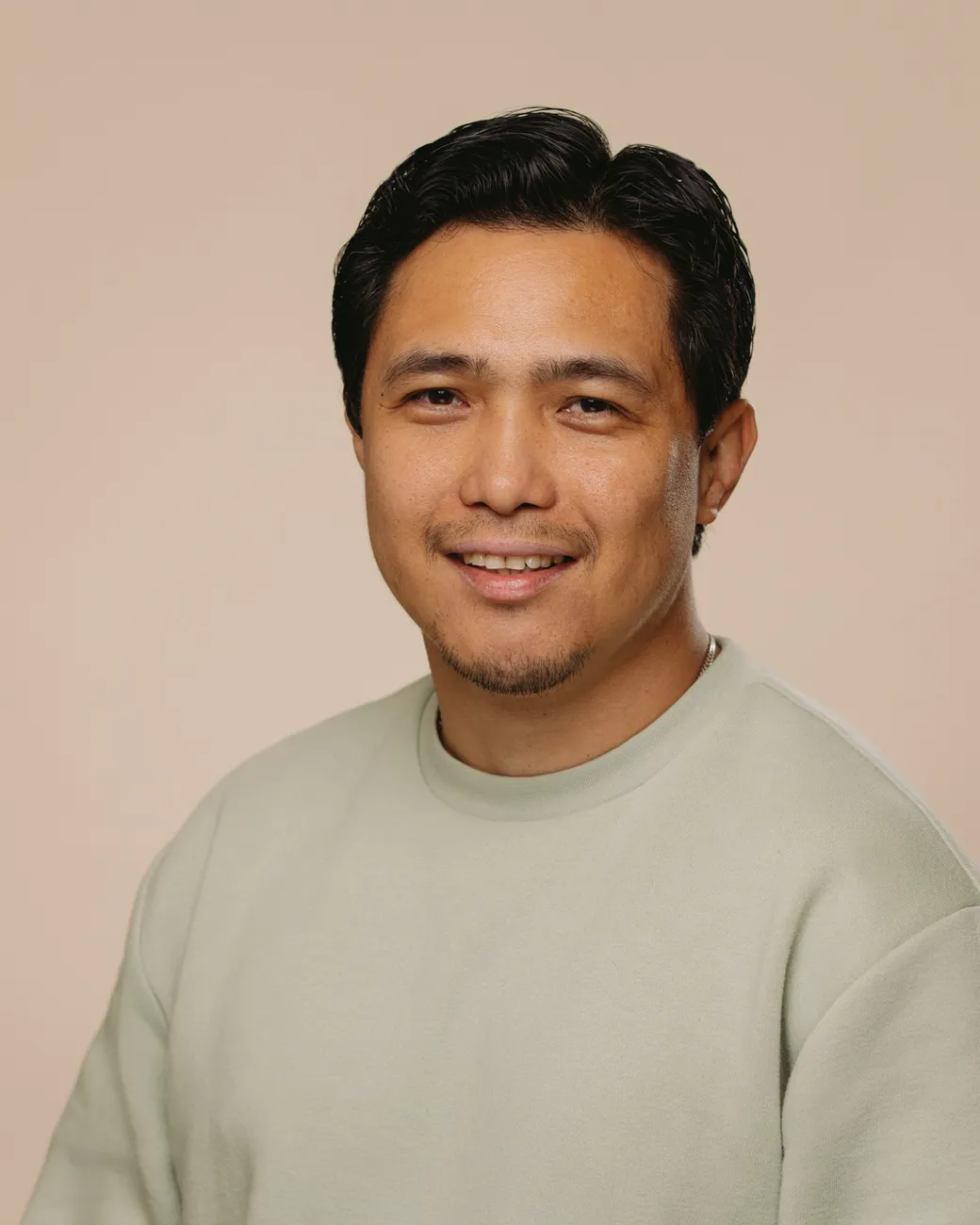 Ariel Lim Senior SEO Developer at House of Psalm professional headshot wearing pale green jumper