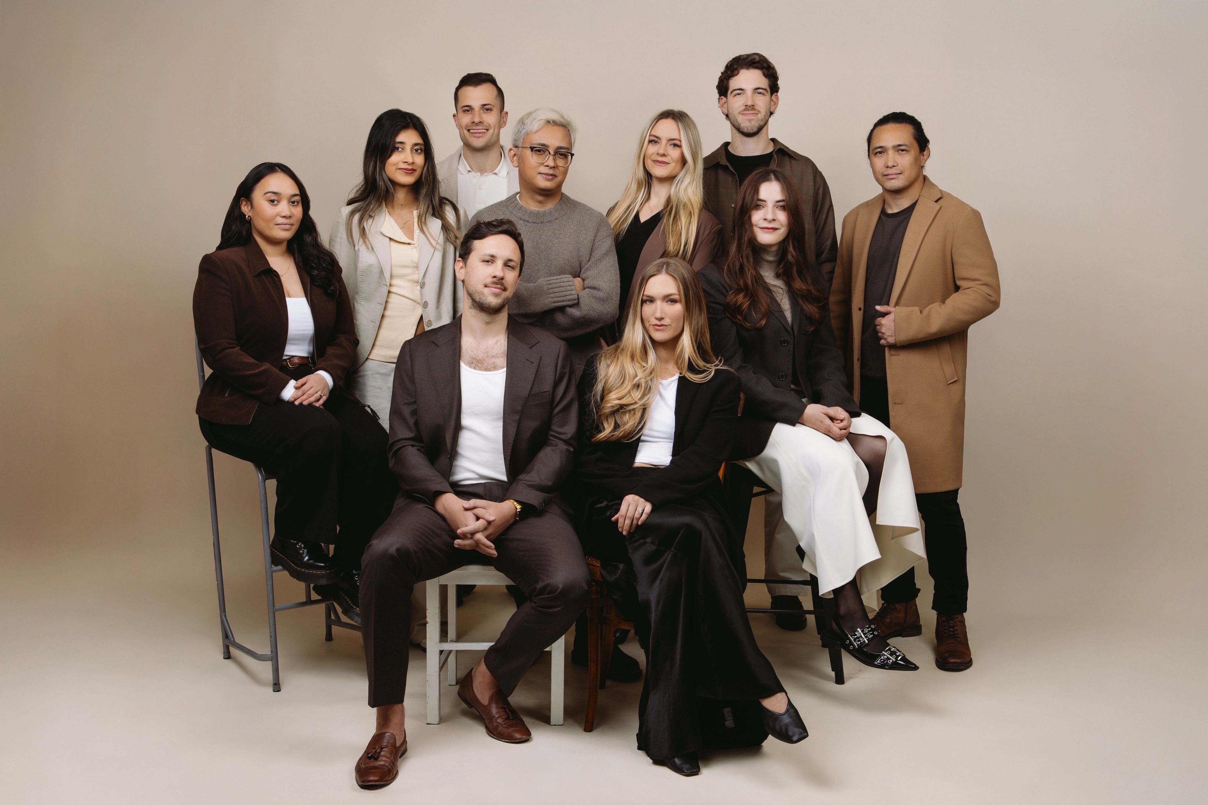 House of Psalm leadership and team professional studio portrait in business attire against neutral background