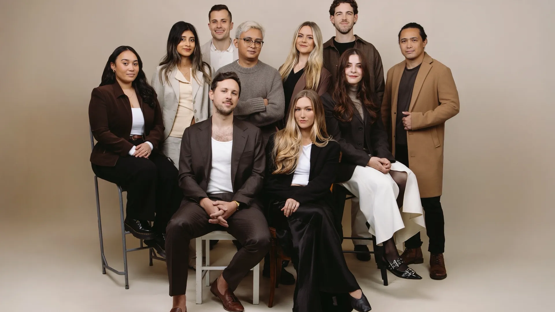 House of Psalm leadership and team professional studio portrait in business attire against neutral background