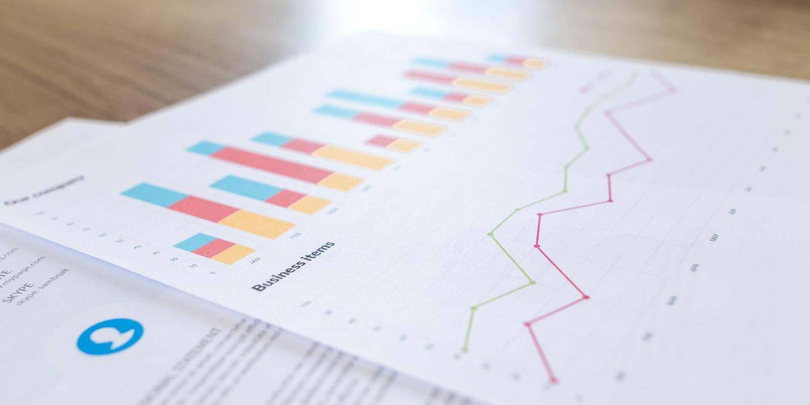 Printed page of B2B and B2C direct mail statistics showing response rates, QR scan rates, leads and conversions from direct mail campaigns