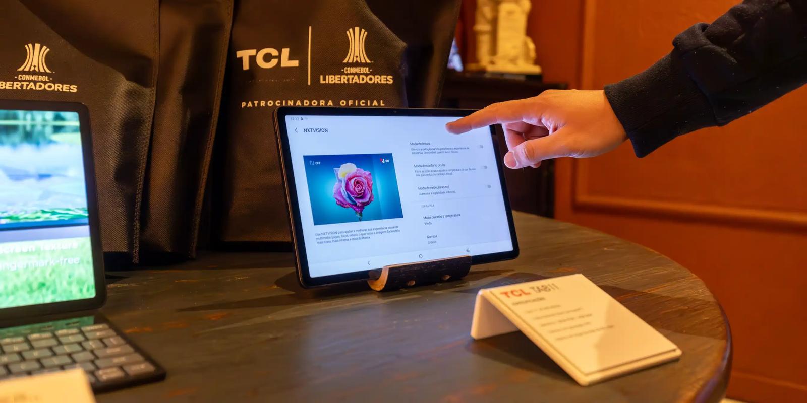 Person working at a laptop, illustrating a demo-booking campaign for a SaaS company.