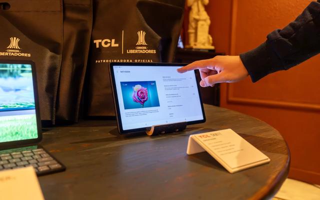 Person working at a laptop, illustrating a demo-booking campaign for a SaaS company.