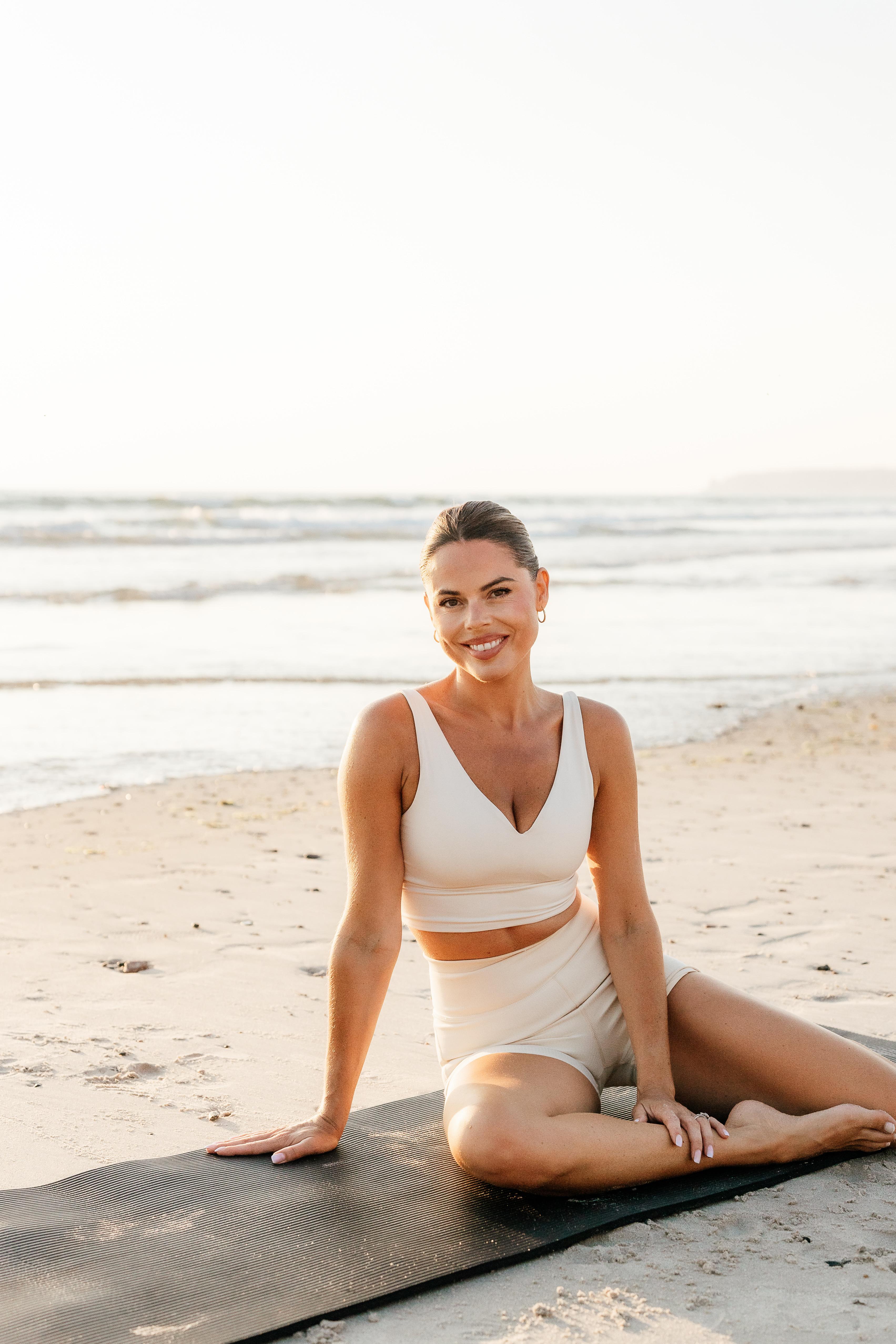 Tabitha smiling at the camera on the beach