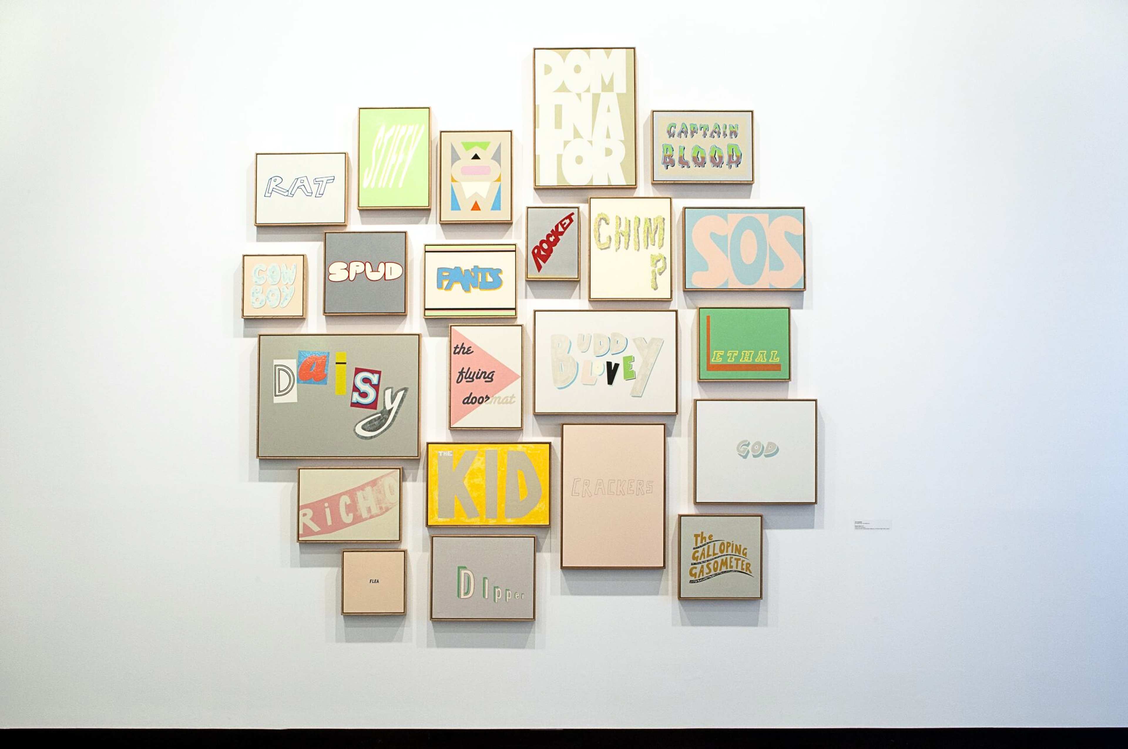 A grouping of paintings featuring words like 'SPUD', 'SOS', 'RAT', 'KID', 'CAPTAIN BLOOD' etc.