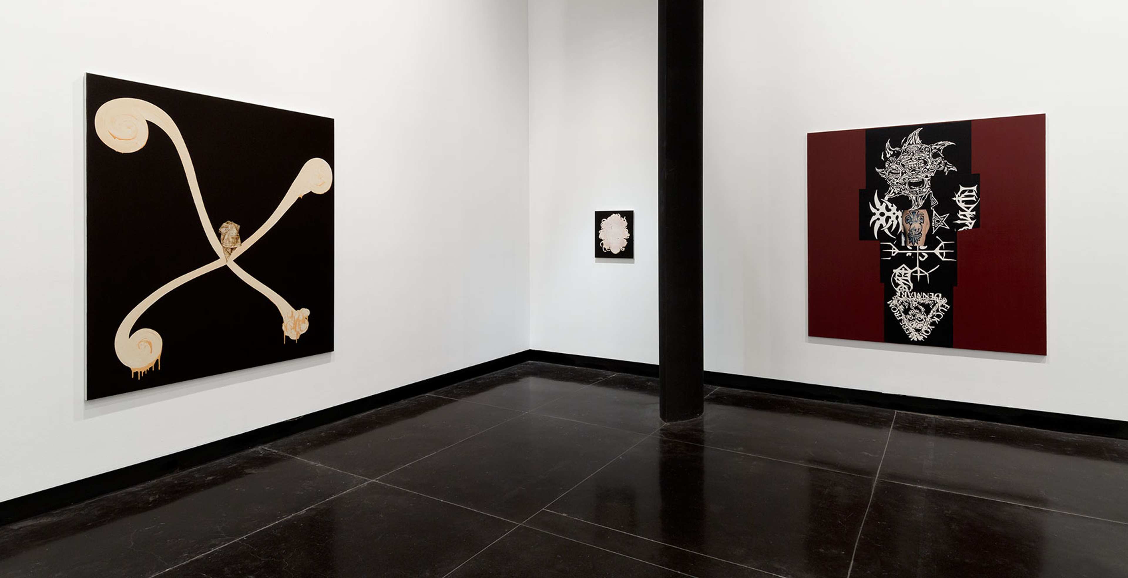 A photograph of a gallery space with two large and one small abstract painings in black, white and dark red. The painting on the left features a curly white X on black background.