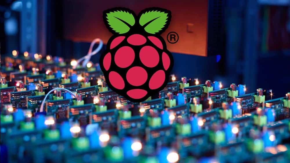 Rows of Raspberry Pi boards beneath a large Raspberry Pi logo.