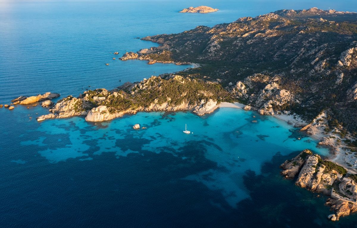 View from above, aerial shot, stunning panoramic view of Spargi Island with Cala Corsara. La Maddalena archipelago National Park, Sardinia, Italy.