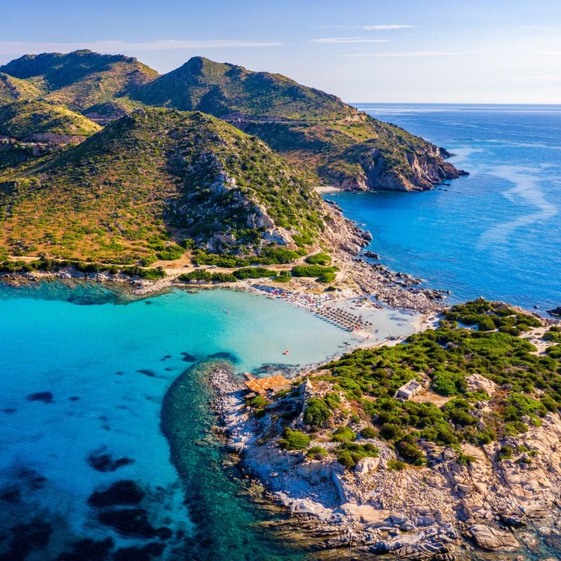 Cost of Sardinia: Peninsula of Punta Molentis. View of beautiful beach at Punta Molentis, Villasimius, Sardinia, Italy. Beautiful bay with sandy beach at Punta Molentis, Sardinia island, Italy.