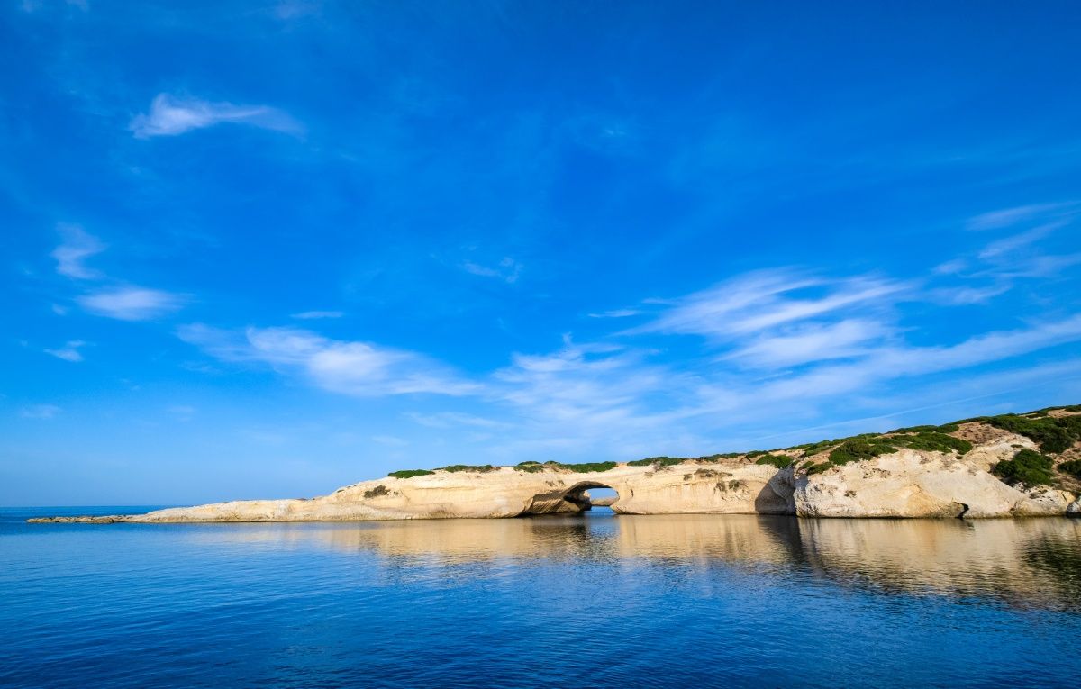 Rock arch S'Archittu, a natural landmark in western Sardinia, Italy