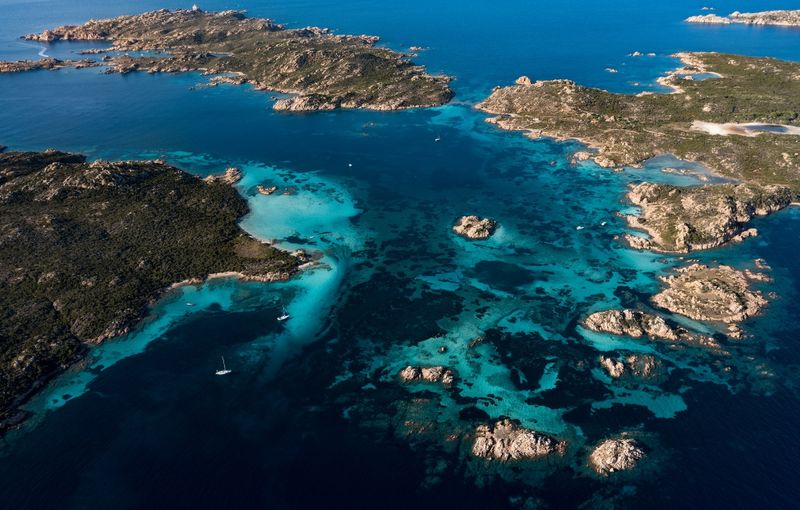 Budelli, Razzoli and Santa Maia islands bathed by a turquoise and clear waters. Sardinia, Italy.
