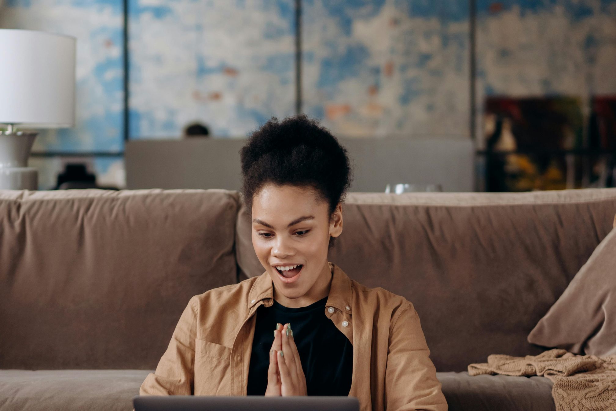A person reviewing financial paperwork to enhance their loan qualifications.